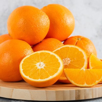 Front,View,Fresh,Sliced,Orange,On,Dark,Background,Ripe,Mellow